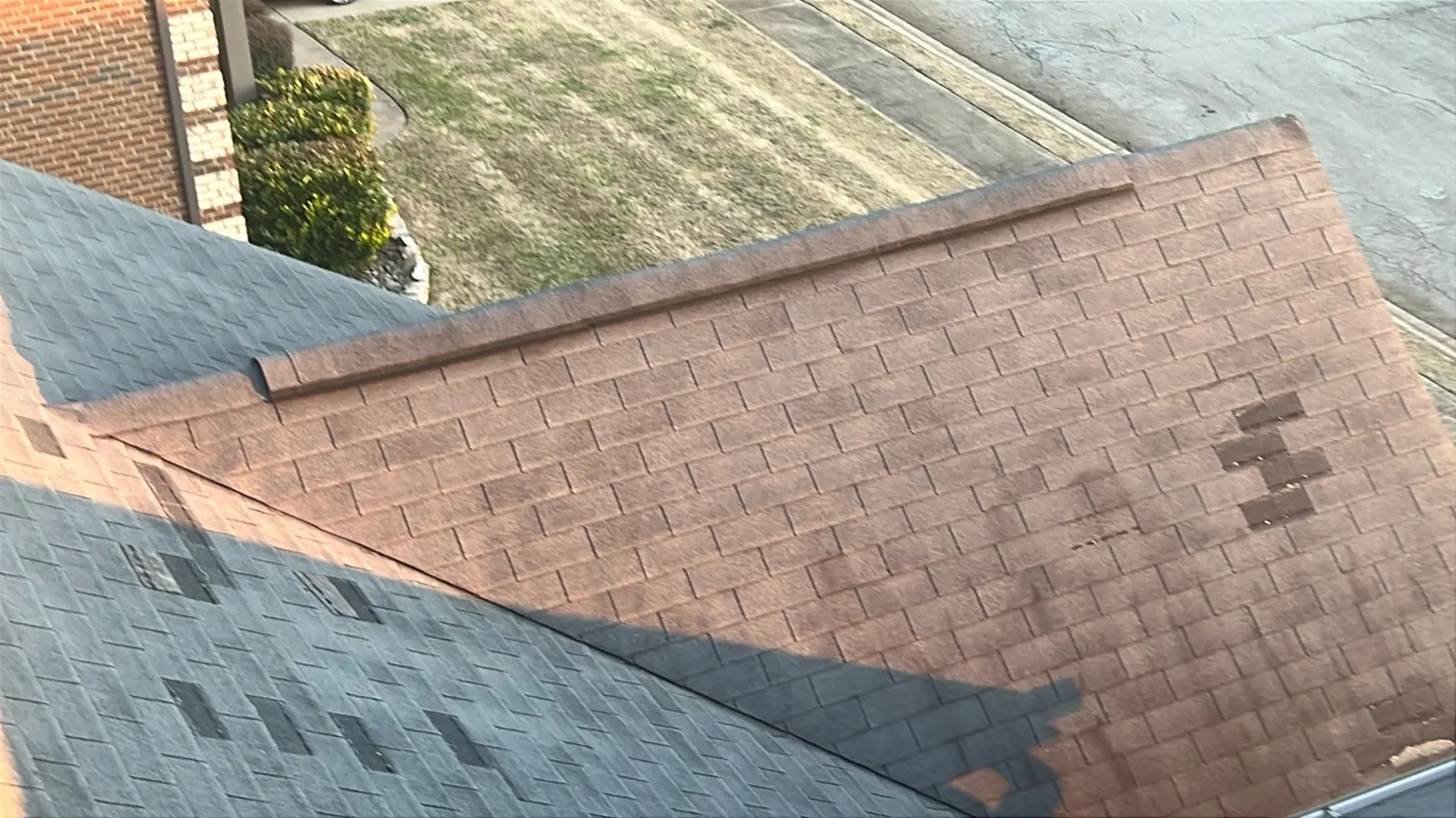 Close view of ridge ventilation and asphalt shingles