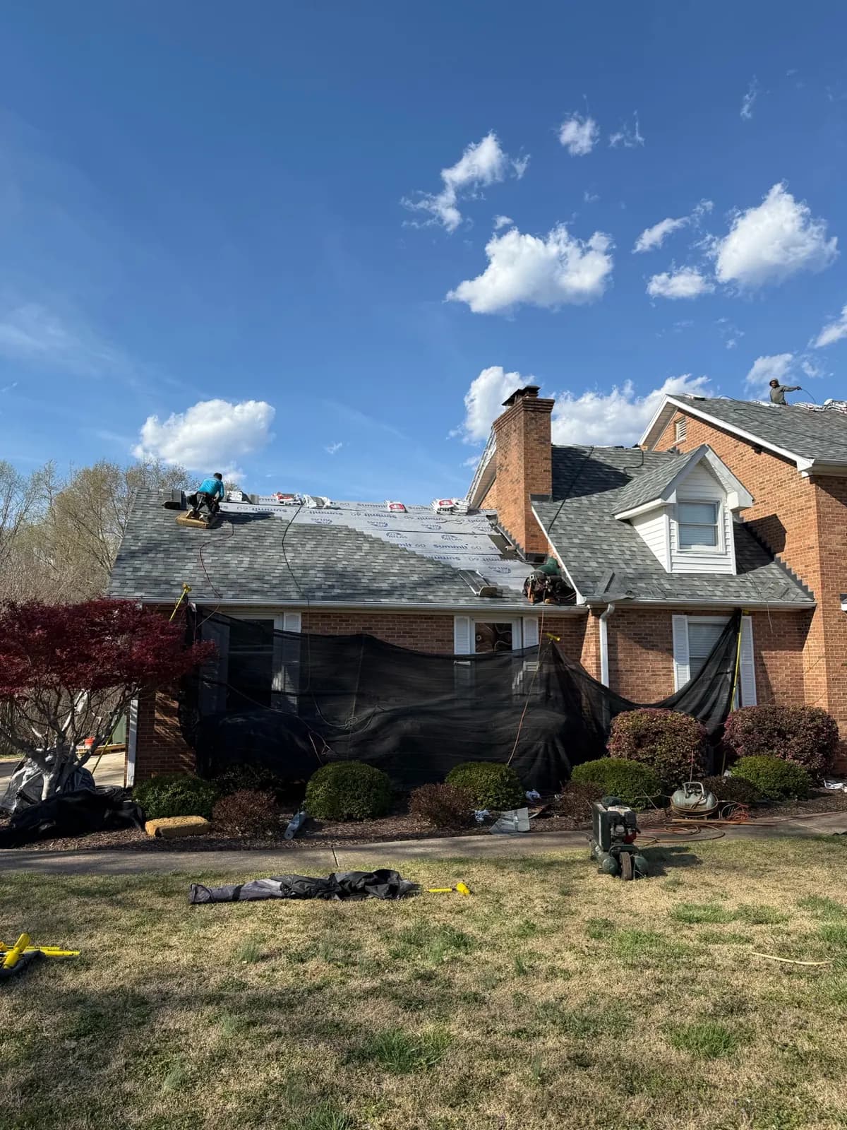 Shingle roof installation in progress